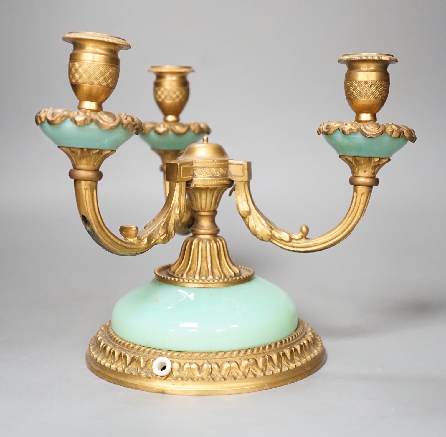 A three branch porcelain and ormolu mounted candelabrum, 19.5cm high